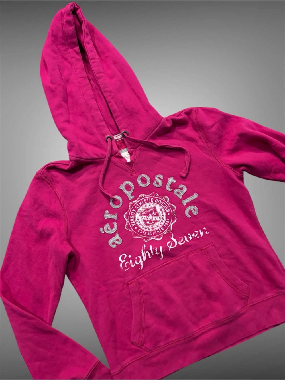 Y2K vintage Aeropostale pink hoodie with graphic design.